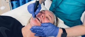 A patient receiving a Hydrafacial treatment at MediZen clinic.
