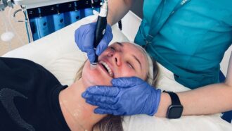 A patient receiving a Hydrafacial treatment at MediZen clinic.