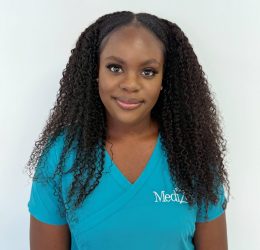 Portrait of Jemimah Dela Tetteh in medical uniform at MediZen.